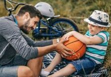 father and son with basketball